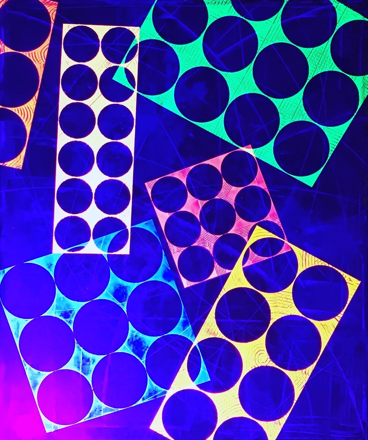 Metallic and fluorescent acrylics painting with colorful circles, under UV light